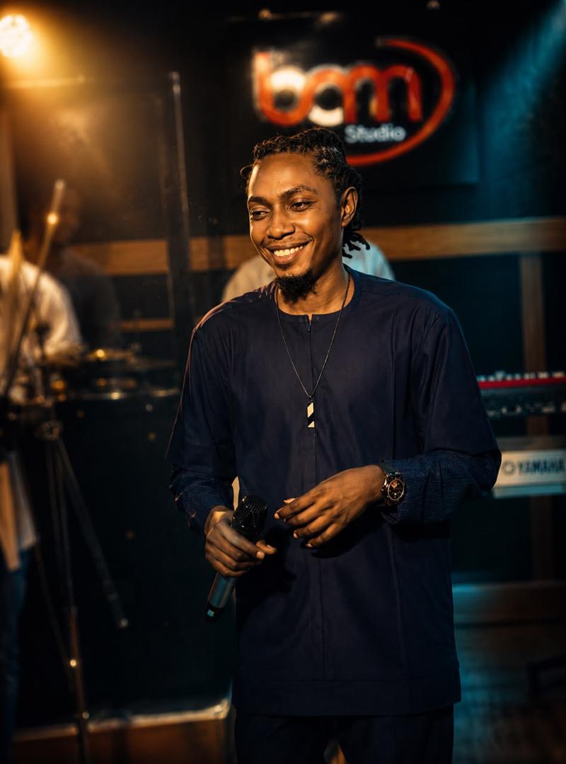 Mr Skylark smiling on stage in navy blue, BCM Studio